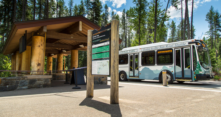 A Glacier National Park shuttle bus parked at the pick-up/drop-off spot.
