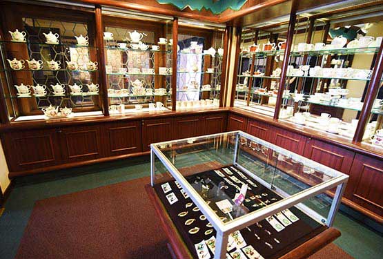 A glass jewelry case in a small shop.