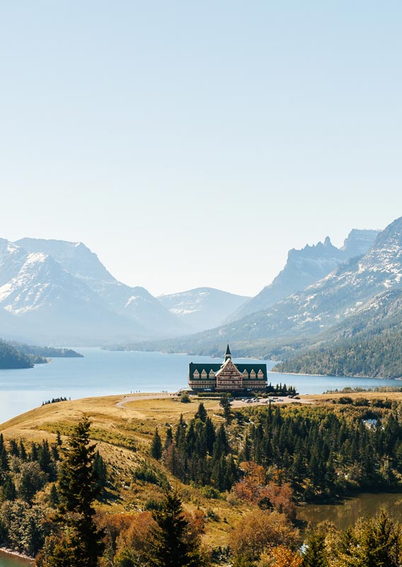 Prince of Wales Hotel on the bluff overlooking Upper Waterton Lake, with mountains across the lake