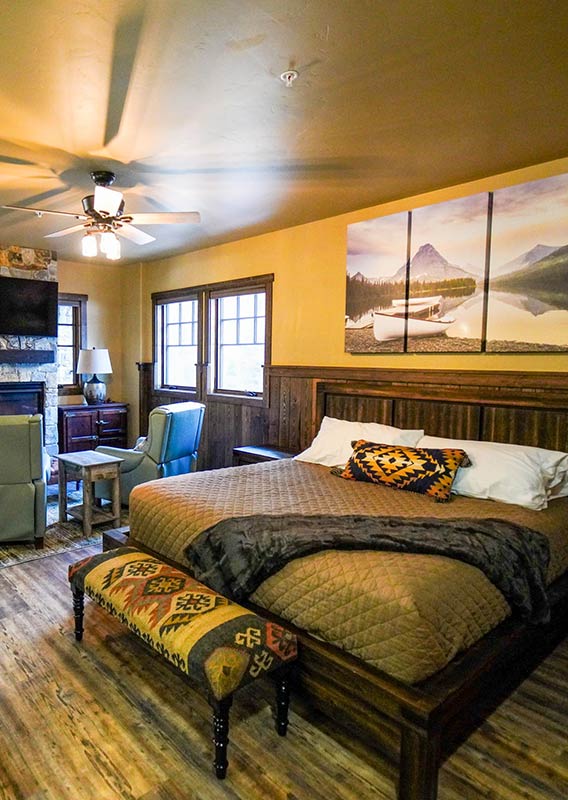 A king bed and living area in a rental suite.