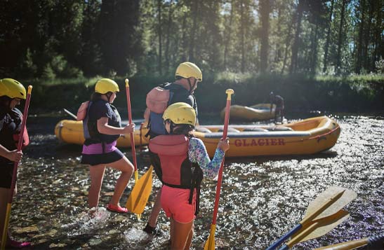 A family about to embark on a rafting adventure