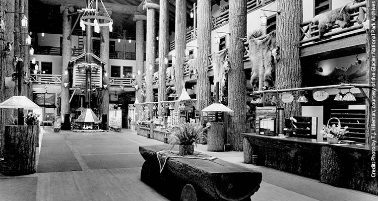 the interior of a wooden lodge, built with large timbers.